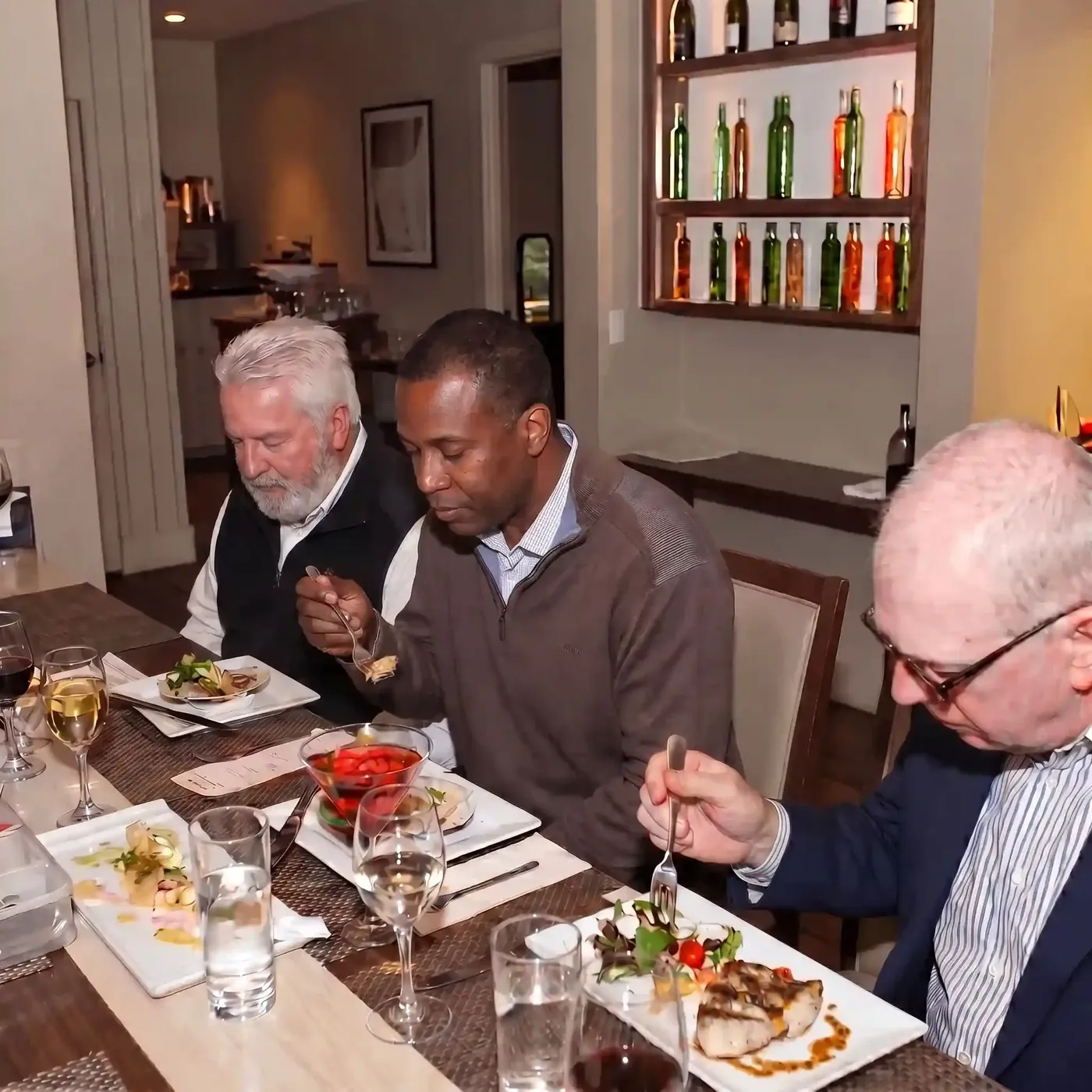 Friends over 45 enjoying dinner together